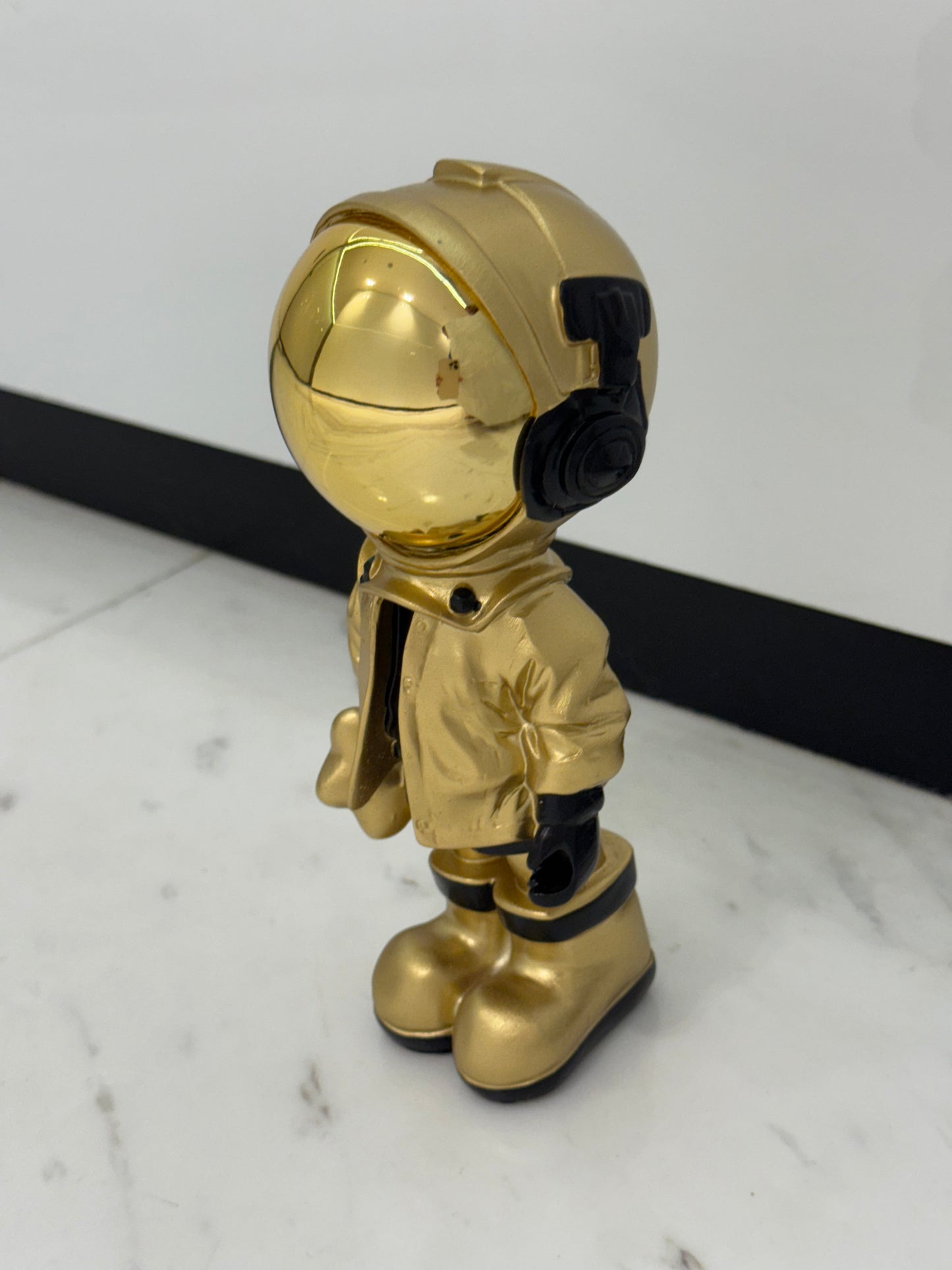 Golden Astronaut Figurine - A Stellar Collectible