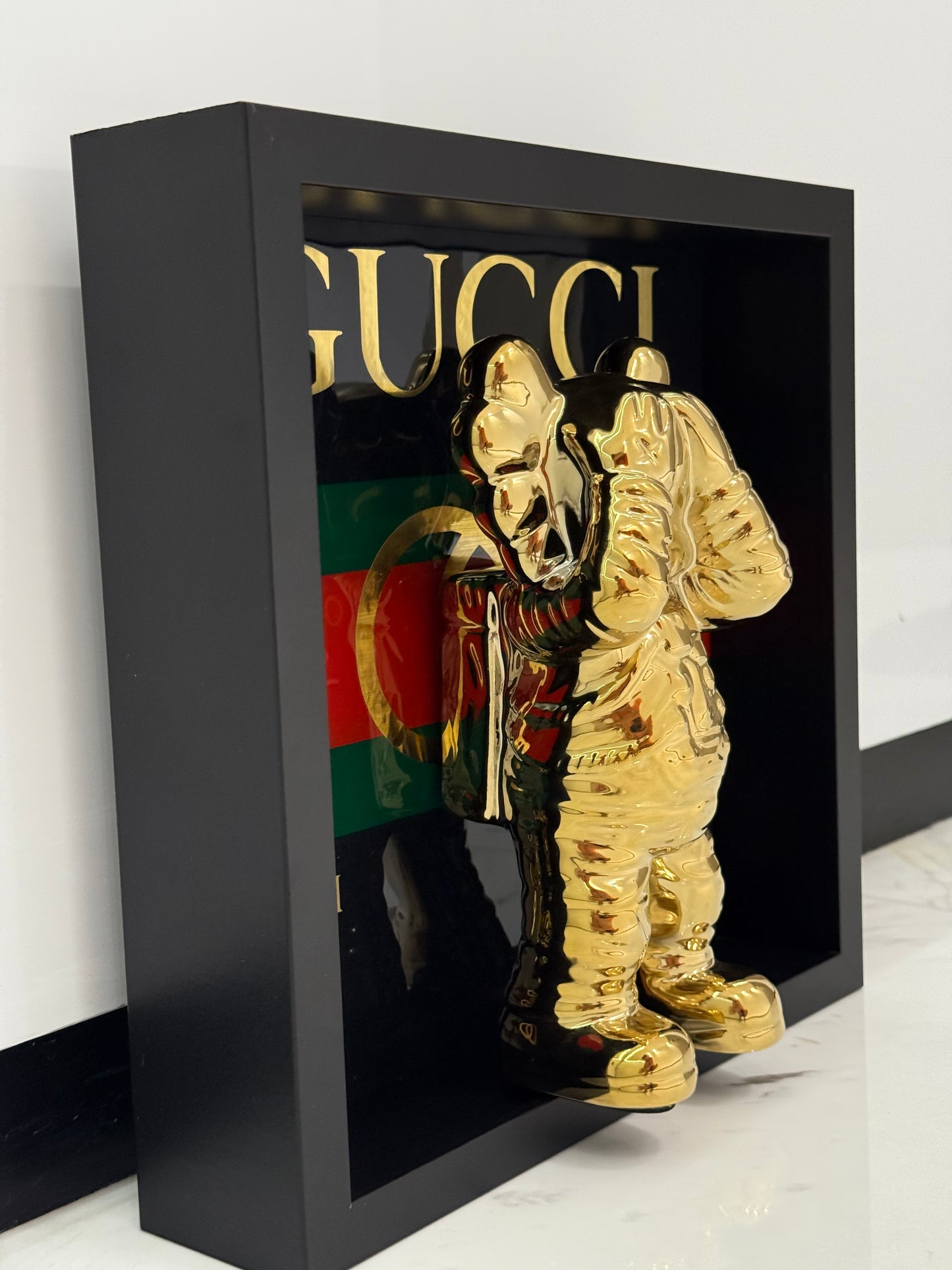 Gold Astronaut in Gucci Box Frame – Luxury Art Meets Iconic Fashion