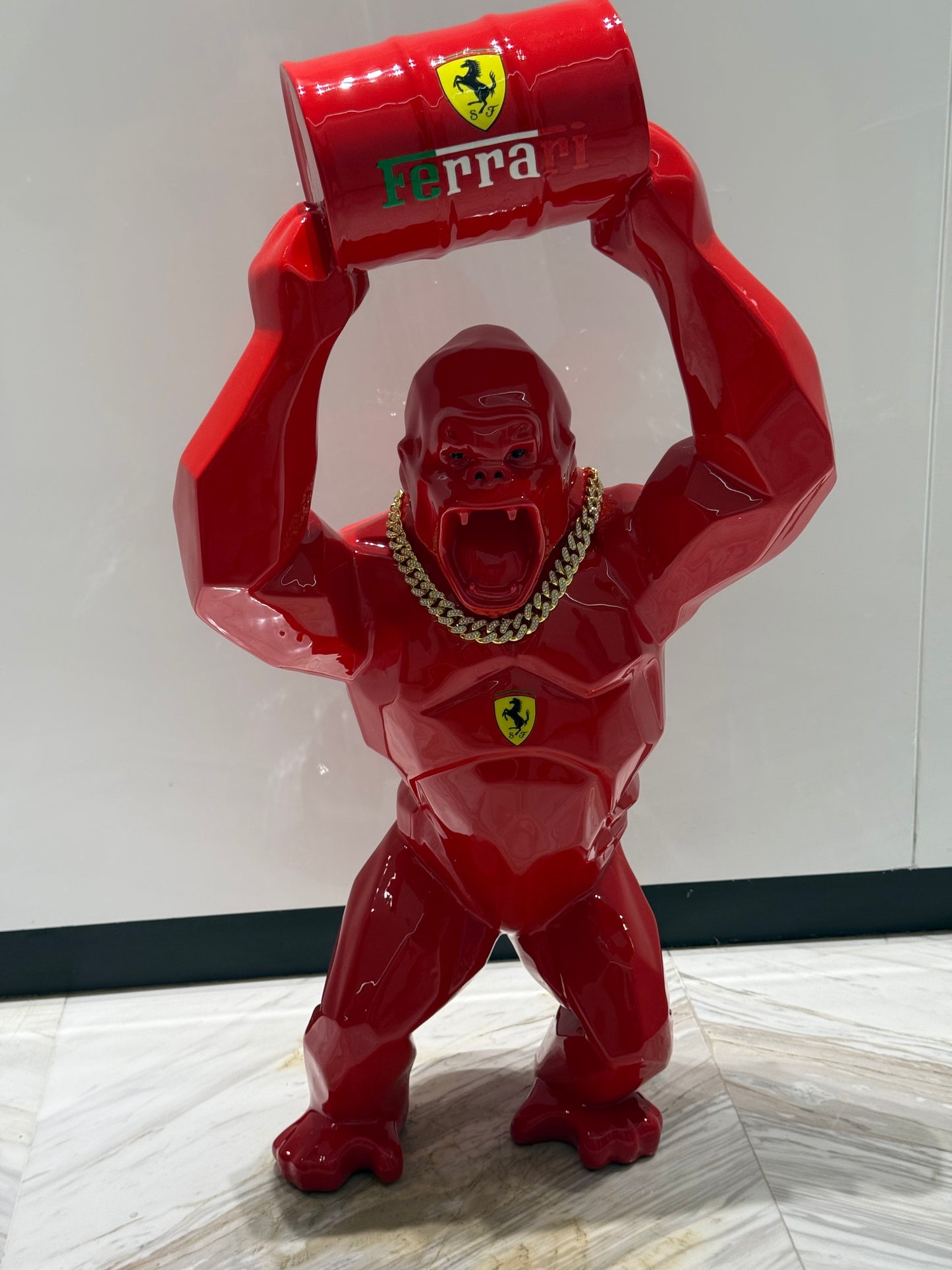 Red Ferrari Gorilla Sculpture with Barrel