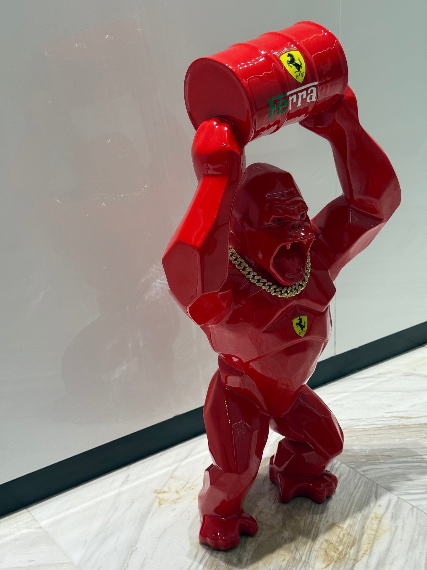 Red Ferrari Gorilla Sculpture with Barrel