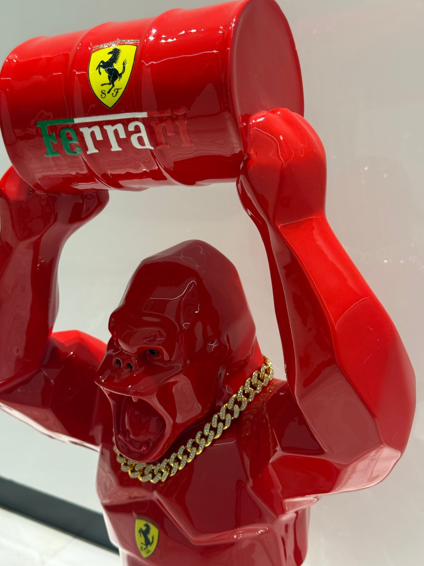 Red Ferrari Gorilla Sculpture with Barrel