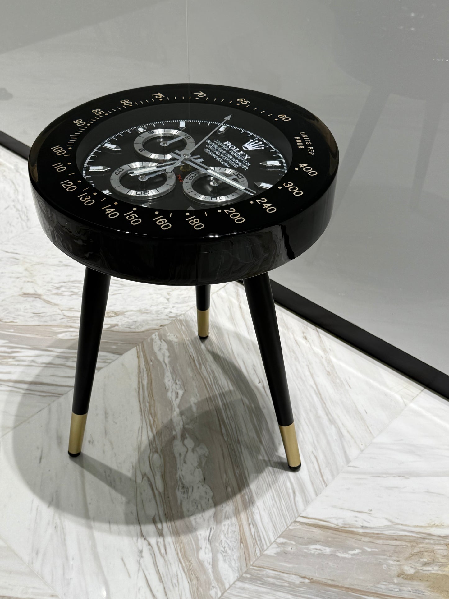 Black Rolex watch round side table