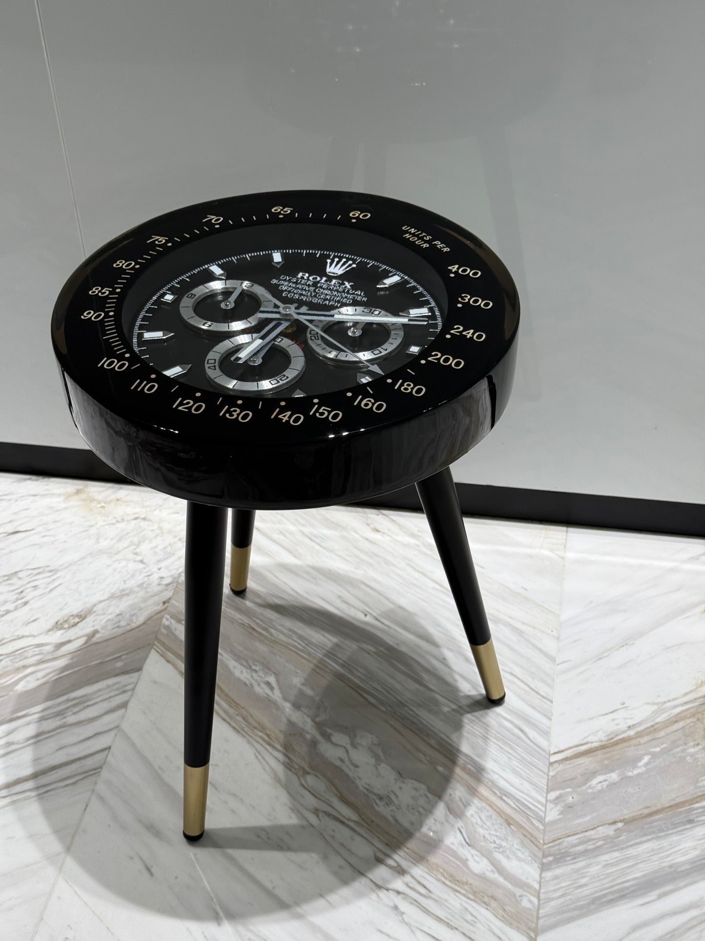 Black Rolex watch round side table